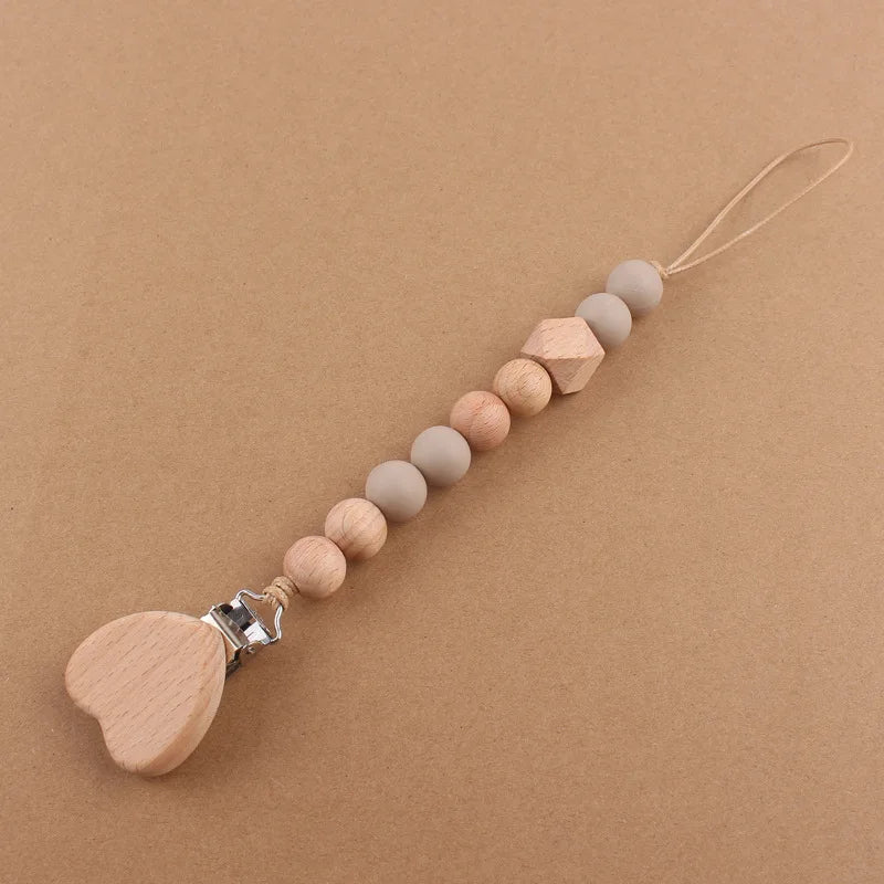 Attache tétine perles en bois de hêtre sécurisé