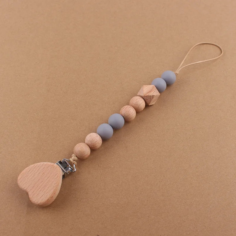 Attache tétine perles en bois de hêtre sécurisé