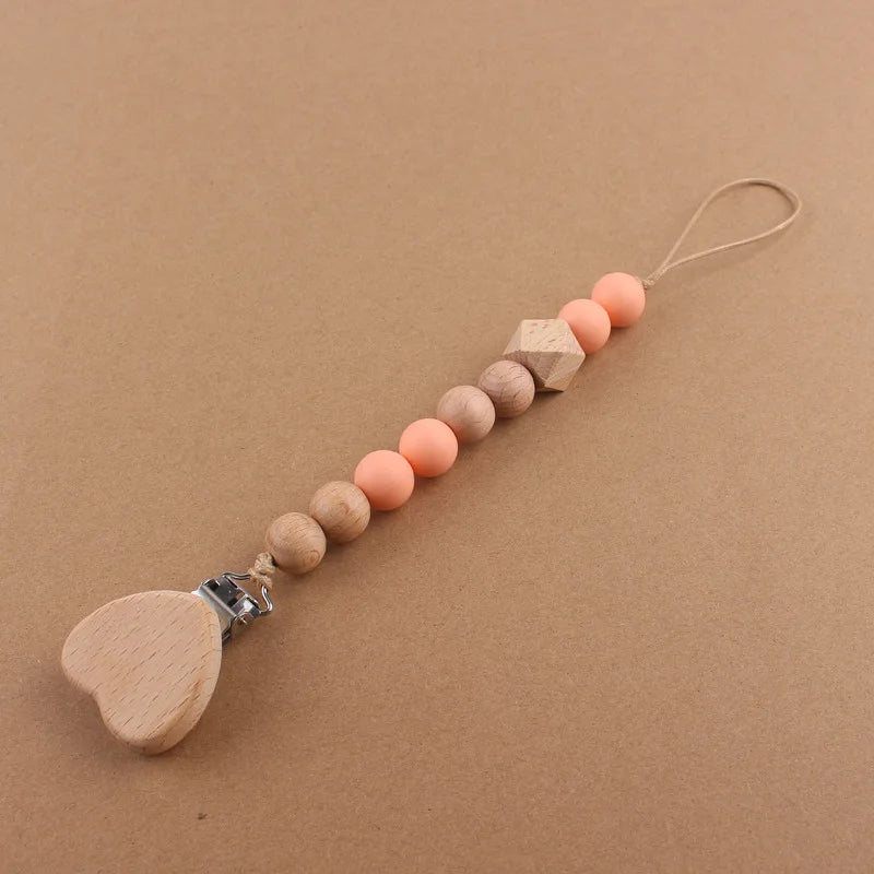 Attache tétine perles en bois de hêtre sécurisé