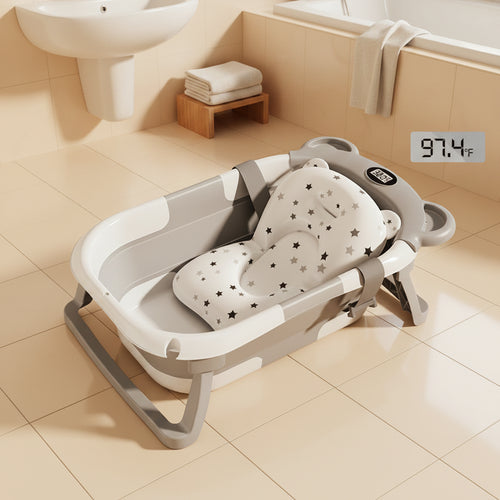 Baignoire bébé pliable avec thermomètre intégré affichant la température de l'eau